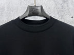 Black Dior crewneck sweatshirt neckline detail with hanging tag