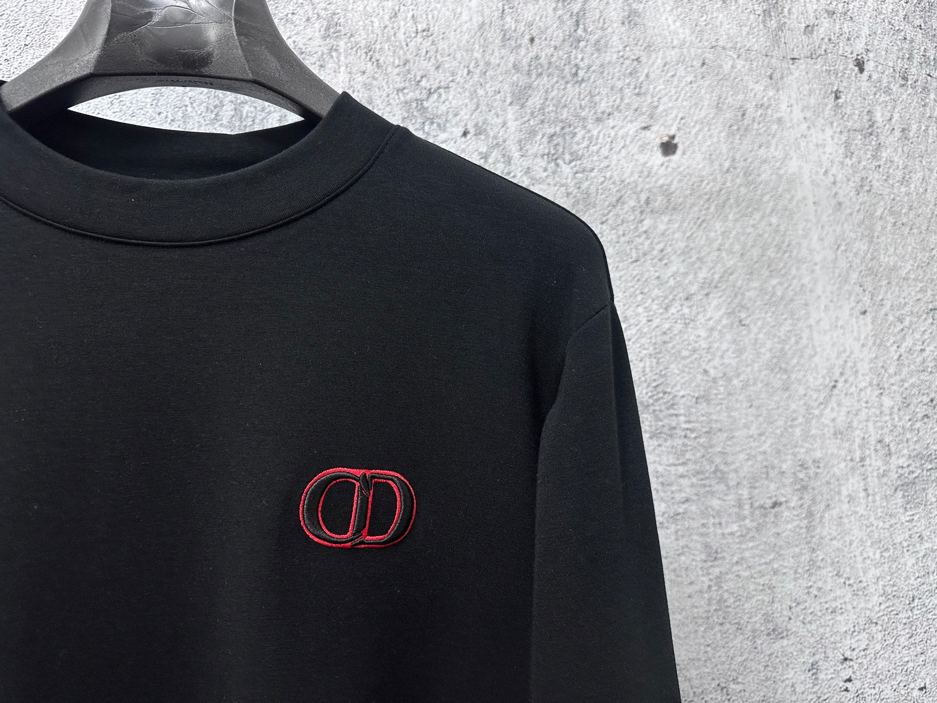 Black Dior crewneck sweatshirt with red CD logo embroidery