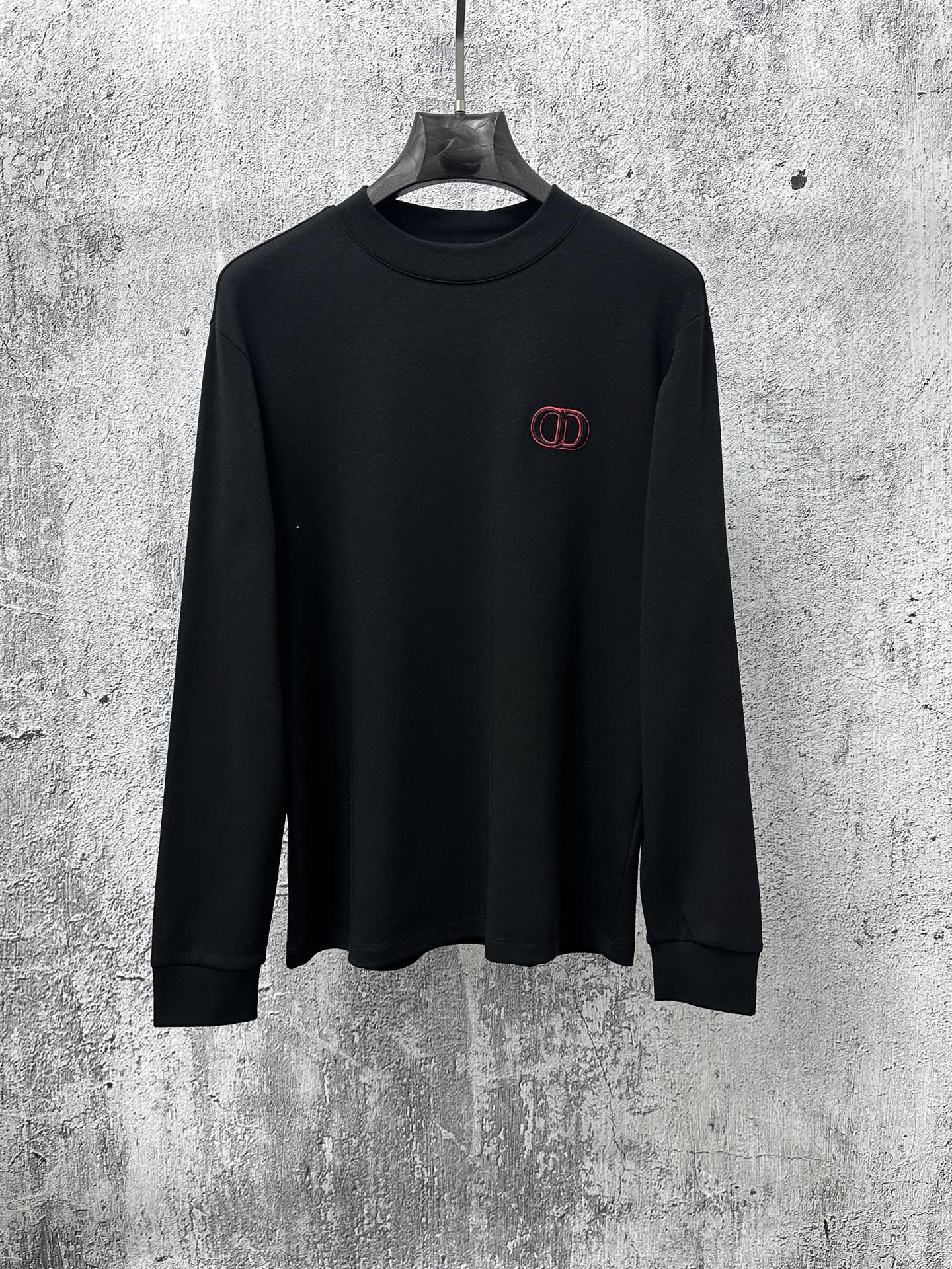 Black Dior long-sleeve crewneck sweatshirt with red embroidered CD logo