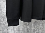 Black sweatshirt hem and ribbed cuffs detail