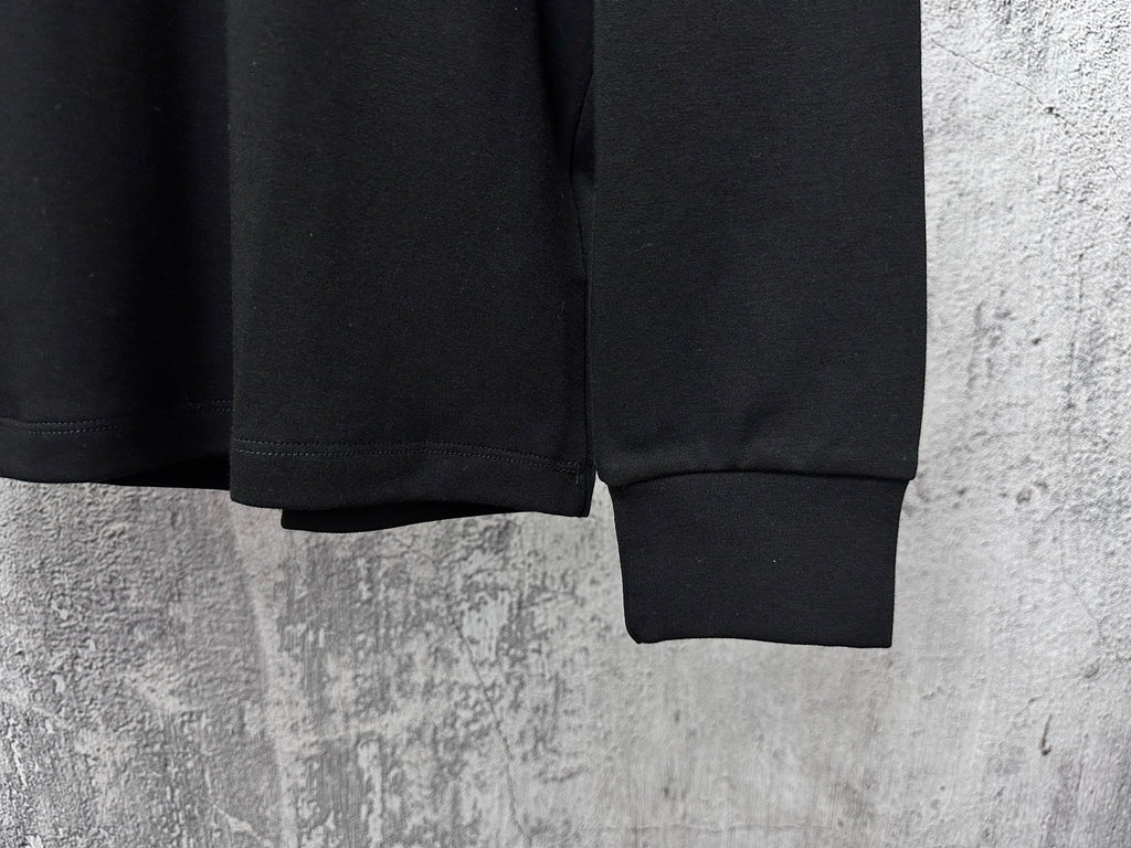 Black Dior crewneck sweatshirt sleeves and ribbed cuffs