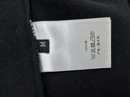 Dior sweatshirt care label on black fabric, 100% cotton