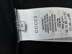 Black T-shirt with Gucci size label and care symbols inside collar