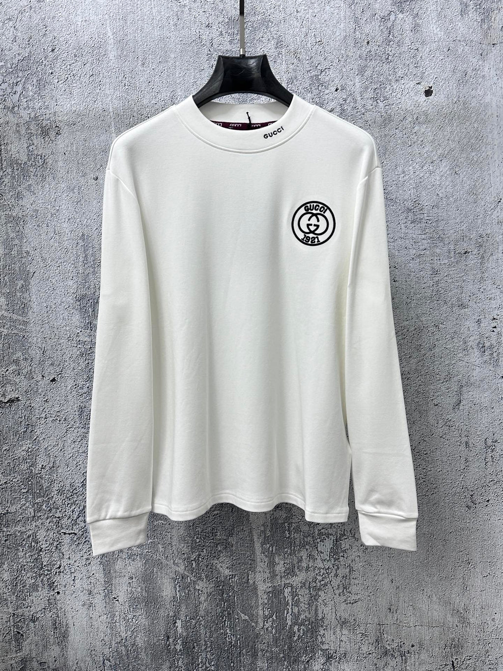 White long-sleeve T-shirt with Gucci patch at chest