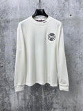 White long-sleeve T-shirt with Gucci patch at chest