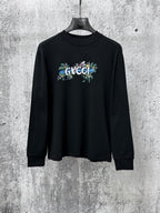 Black long-sleeve sweatshirt with Gucci floral chest logo