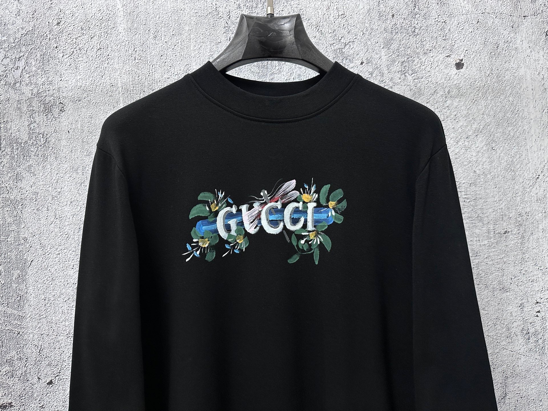 Black long-sleeve sweatshirt with Gucci floral chest logo