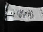 Clothing size label reading M; Gucci and care text inside sweatshirt