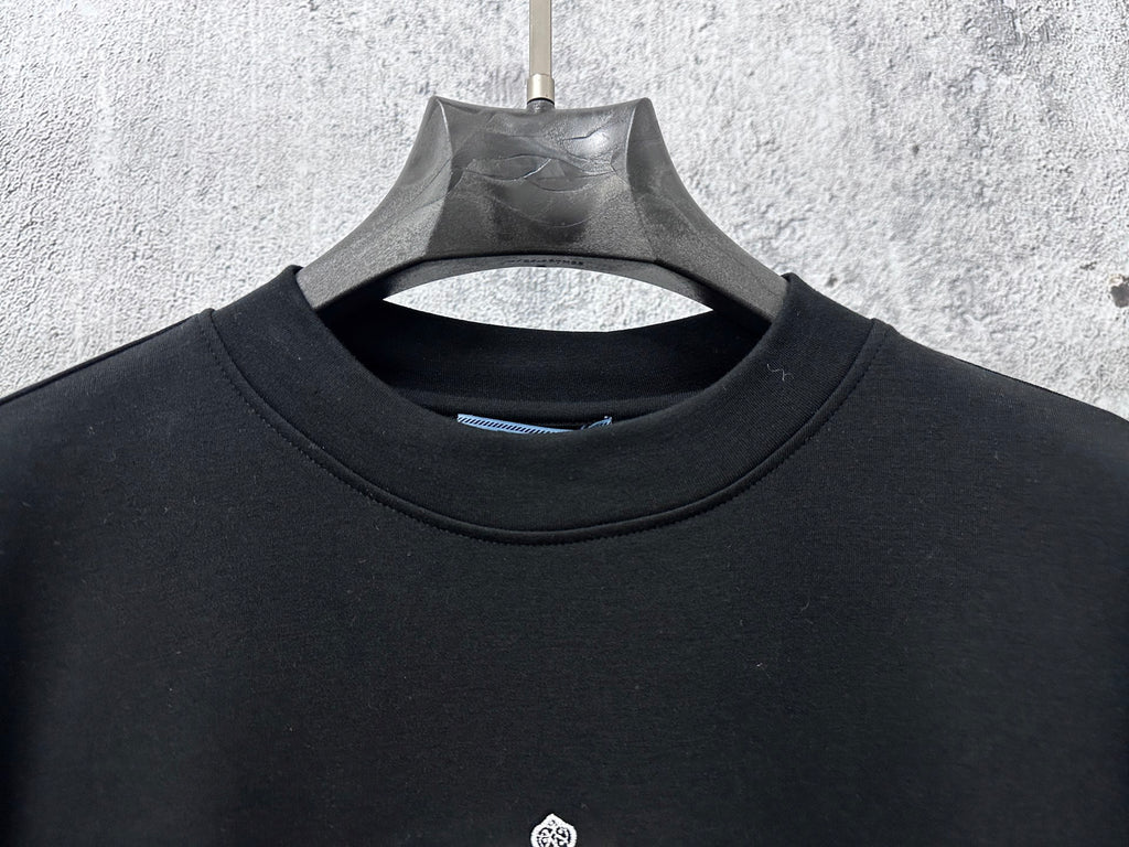 Black long-sleeve sweatshirt crew neck and inner neckline seam detail