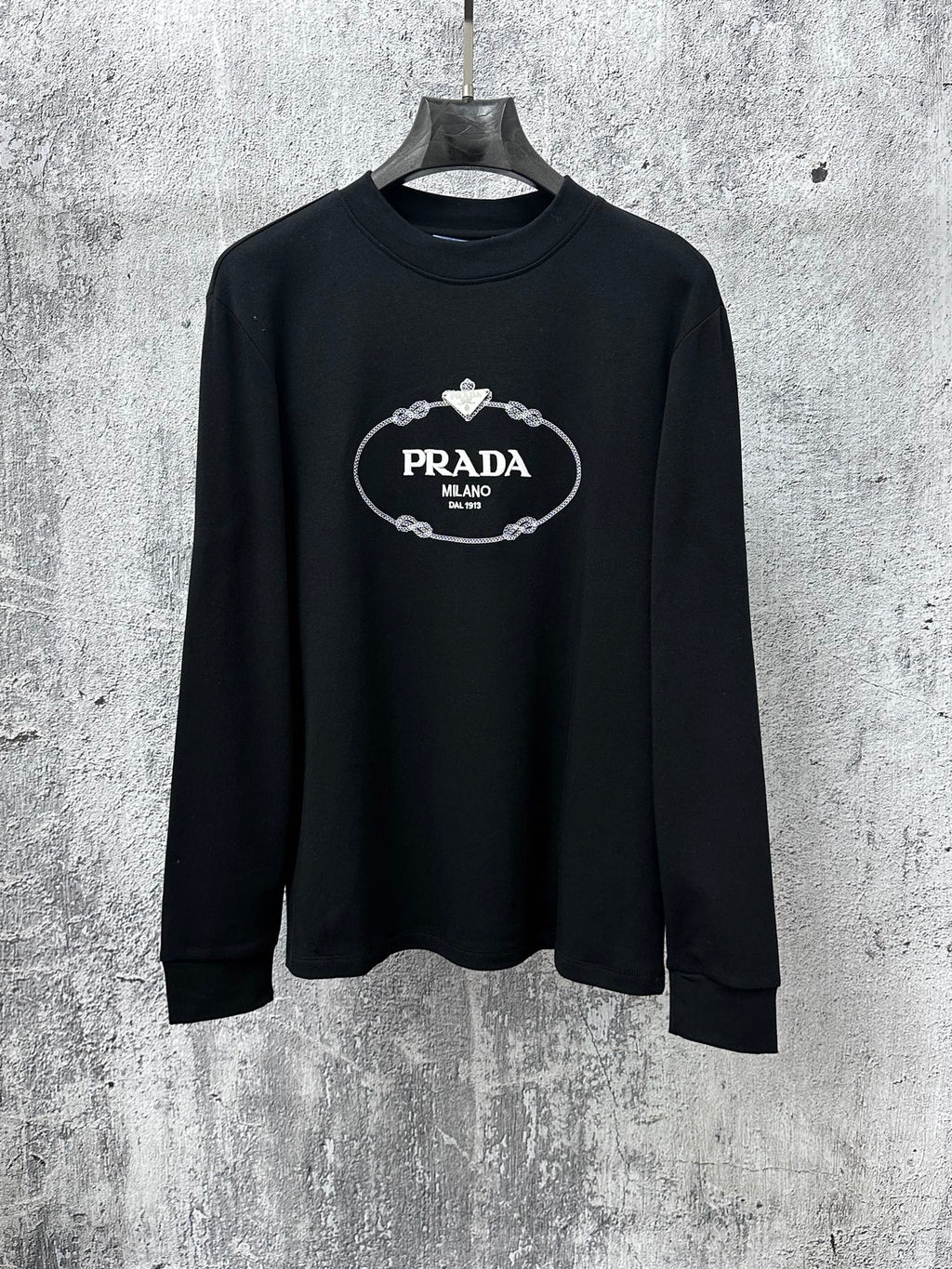 Black long-sleeve sweatshirt with PRADA Milano oval logo chest graphic