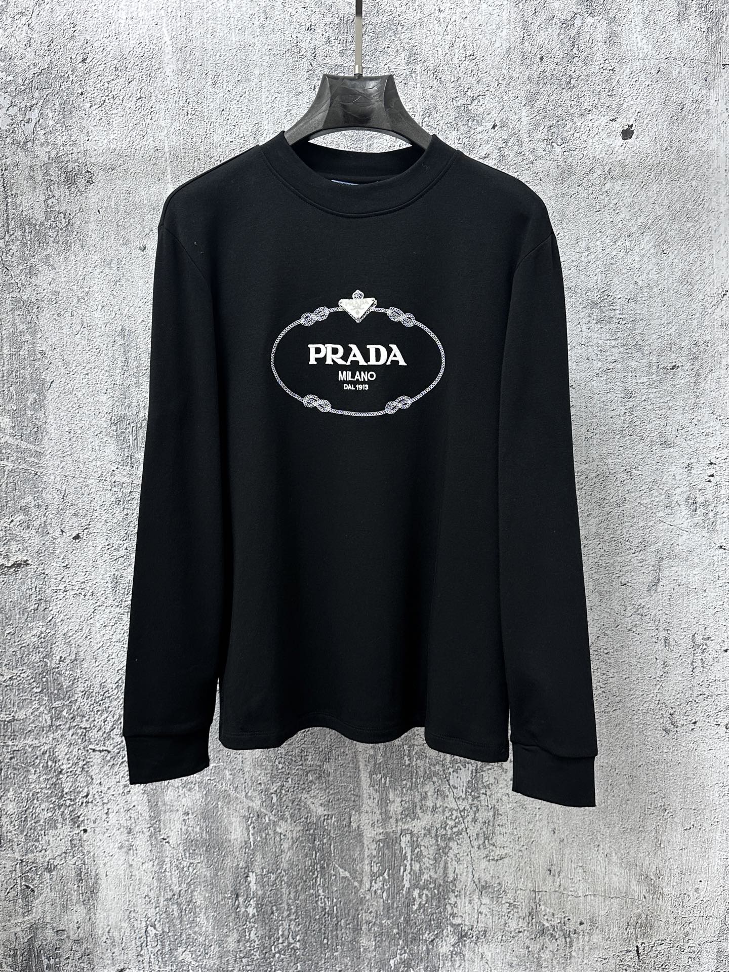 Black long-sleeve sweatshirt with PRADA Milano oval logo chest graphic