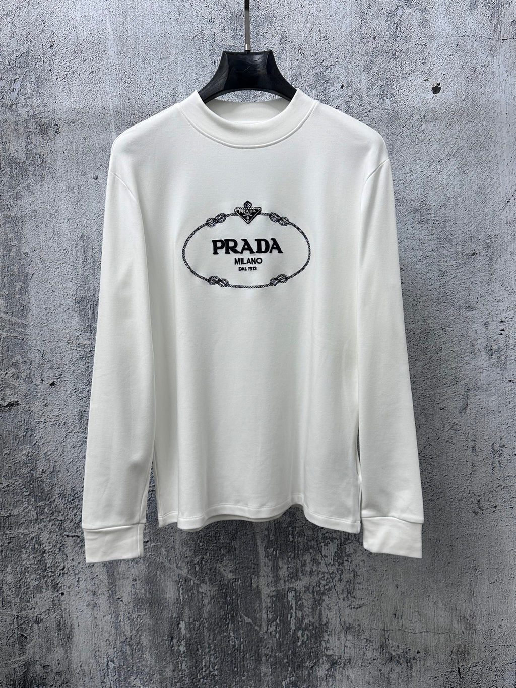 White long-sleeve sweatshirt with PRADA Milano logo on the chest