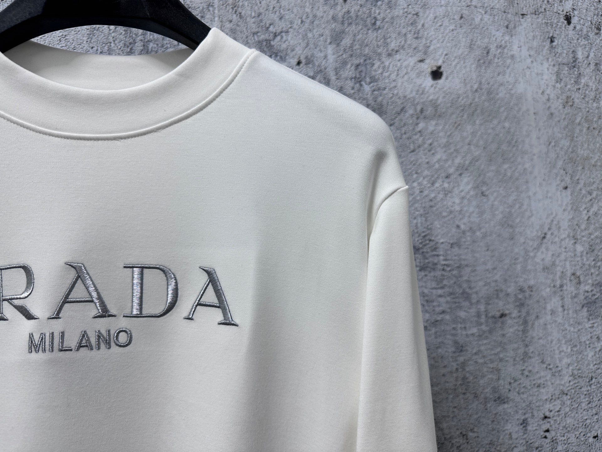 Cream sweatshirt neckline with PRADA Milano logo detail