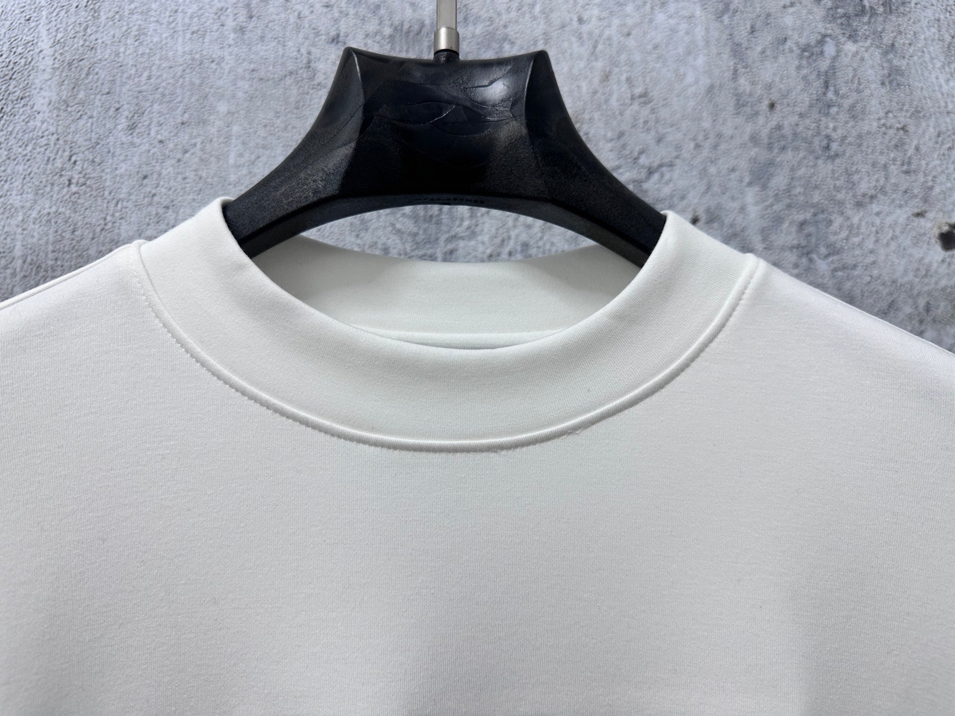 Cream crewneck sweatshirt collar with ribbed trim