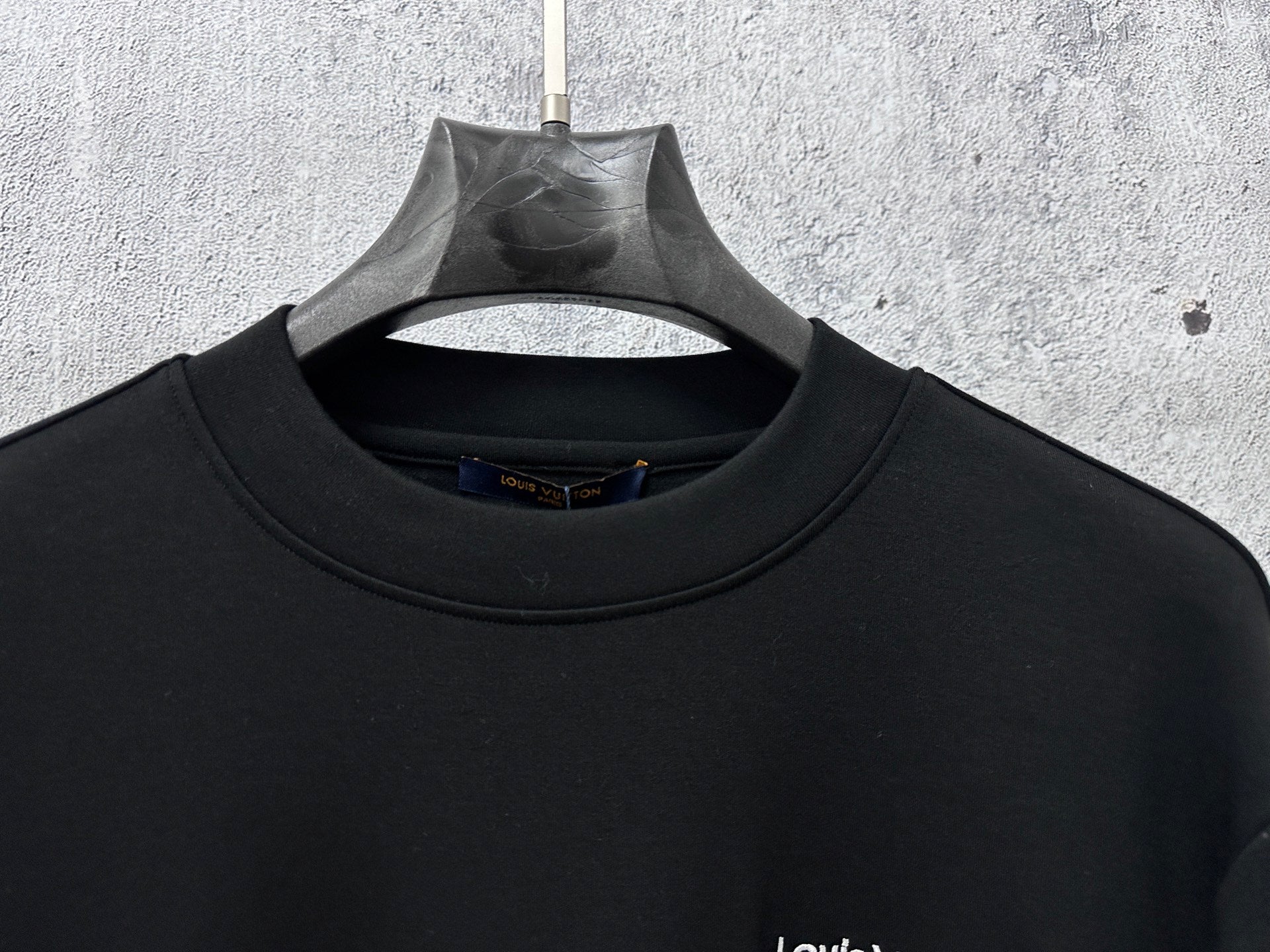 Louis Vuitton long-sleeve sweatshirt neckline close-up, ribbed crew collar
