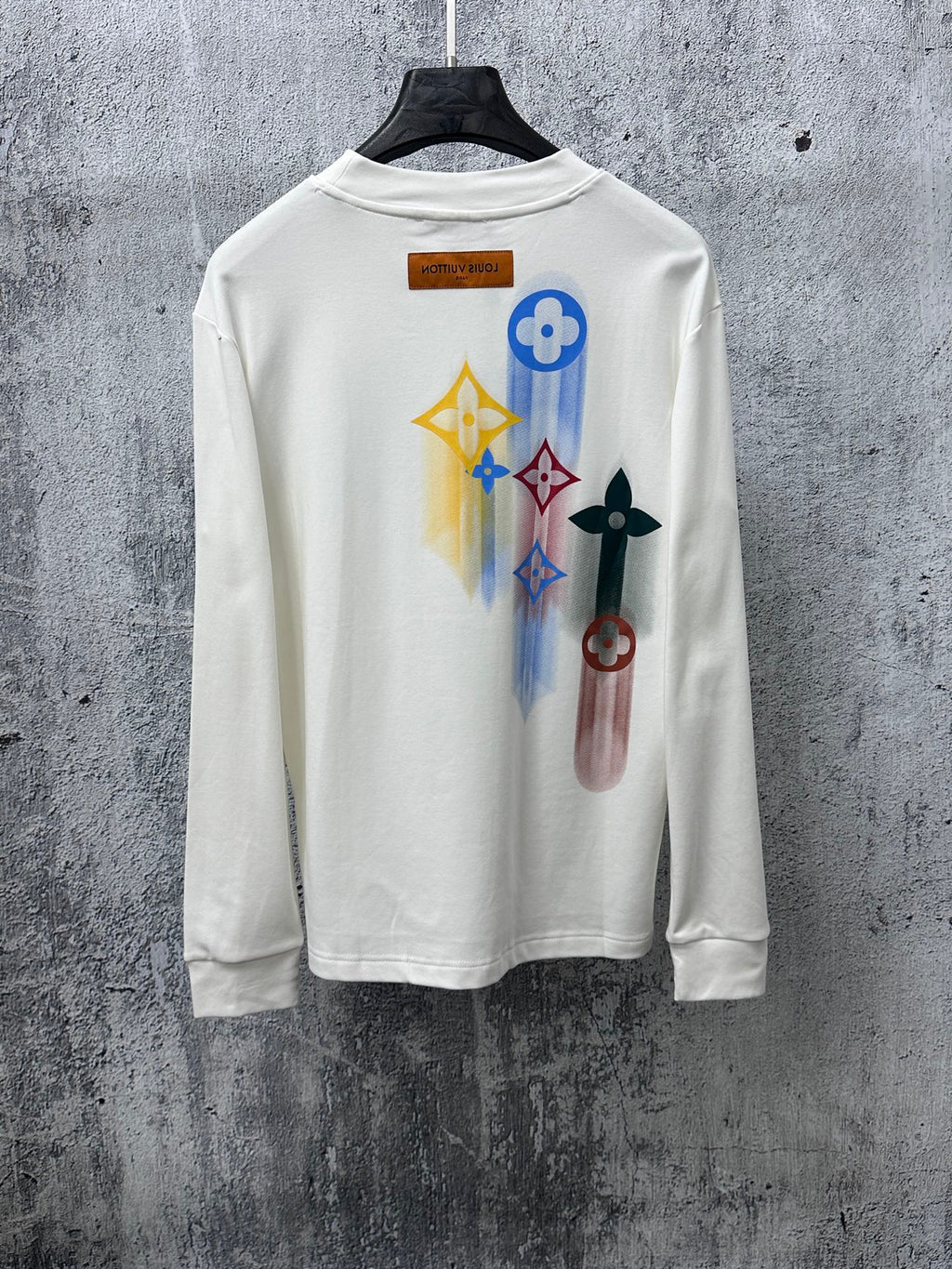 White long-sleeve sweatshirt with colorful back print and Louis Vuitton neckline label