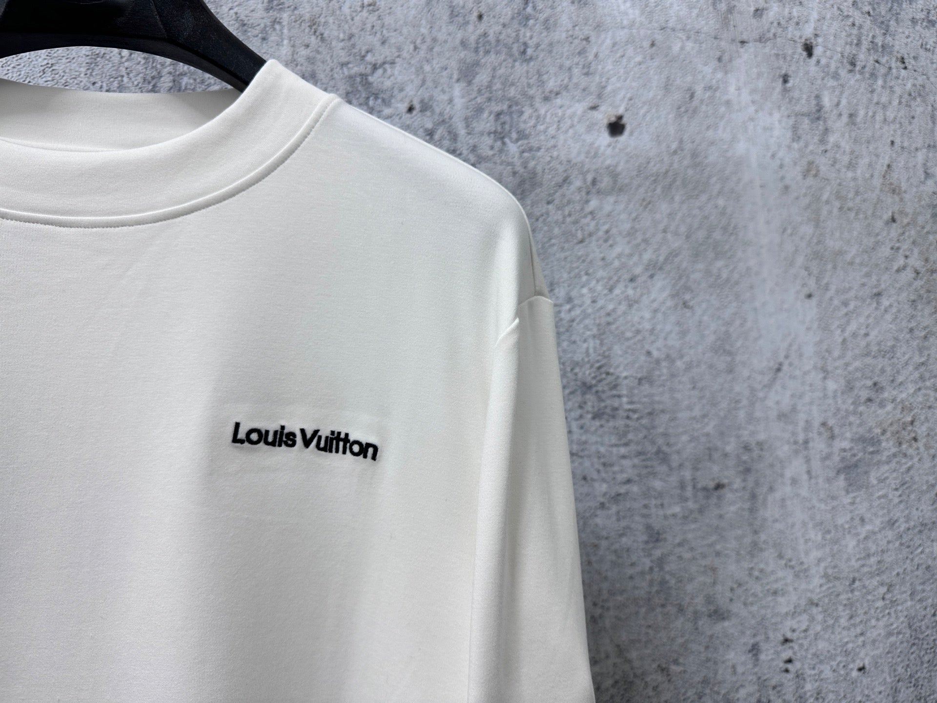 White long-sleeve sweatshirt with Louis Vuitton chest logo