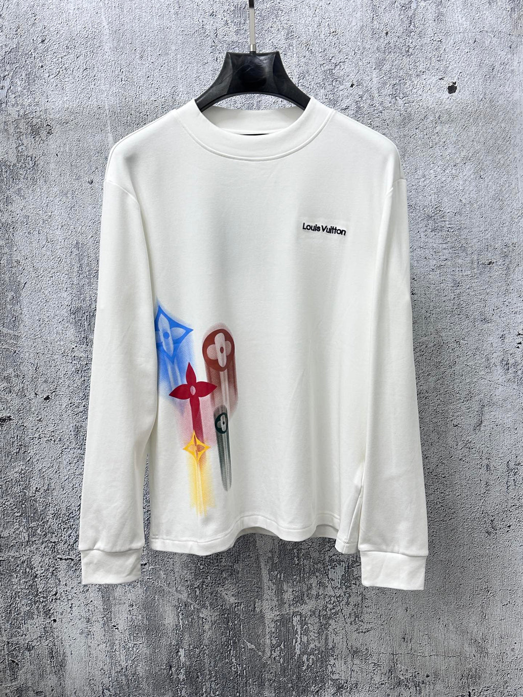 White long-sleeve sweatshirt with multicolor abstract charm print and Louis Vuitton logo