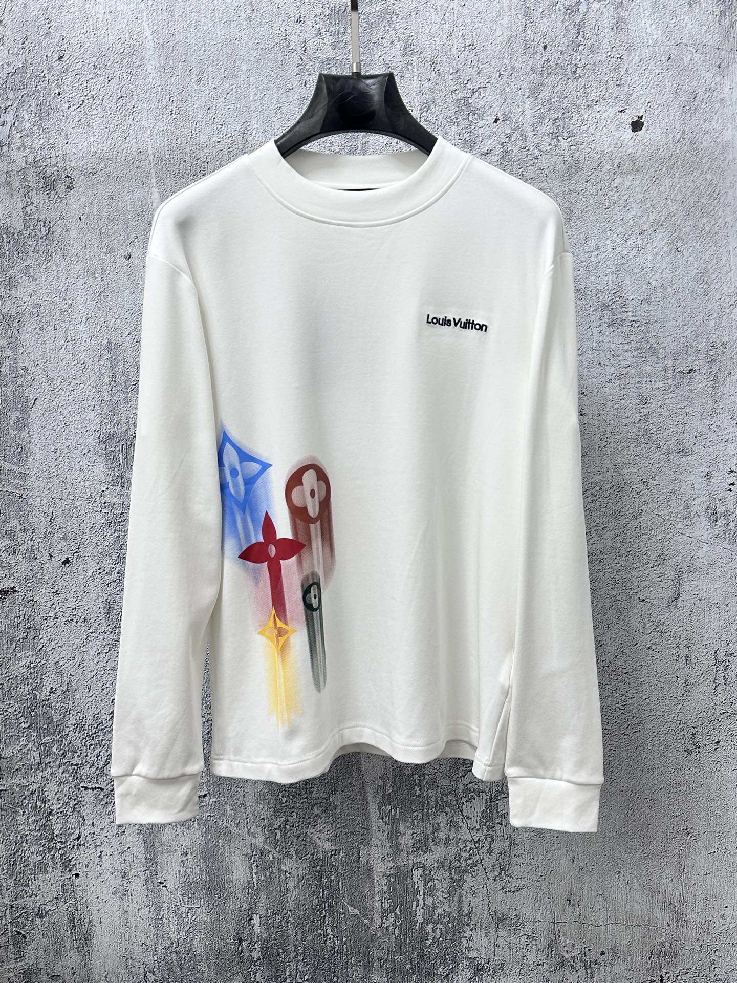 White long-sleeve sweatshirt with multicolor abstract charm print and Louis Vuitton logo