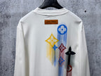 White long-sleeve sweatshirt with large colorful back graphic and Louis Vuitton label