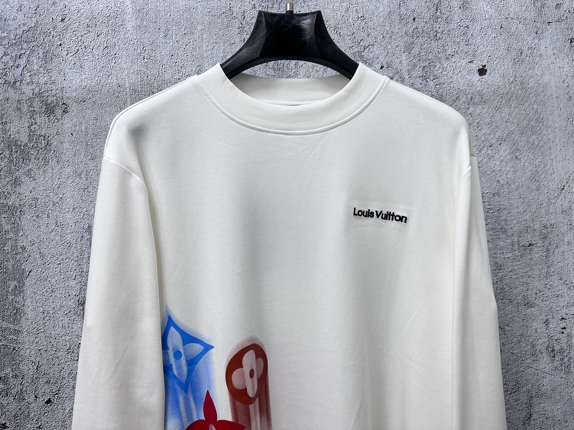 White long-sleeve sweatshirt with Louis Vuitton chest logo and colorful side print