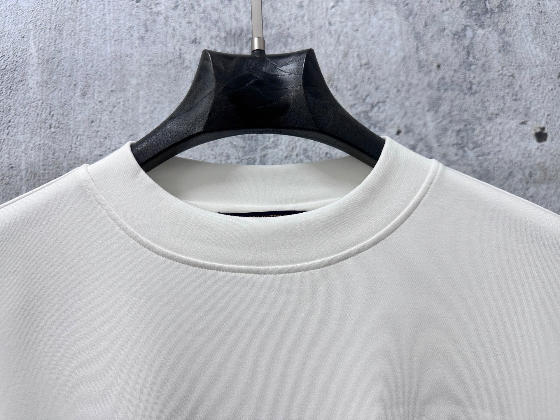 White crewneck long-sleeve sweatshirt collar and smooth fabric