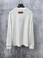 Louis Vuitton long-sleeve crewneck shirt in white, back view with neck label