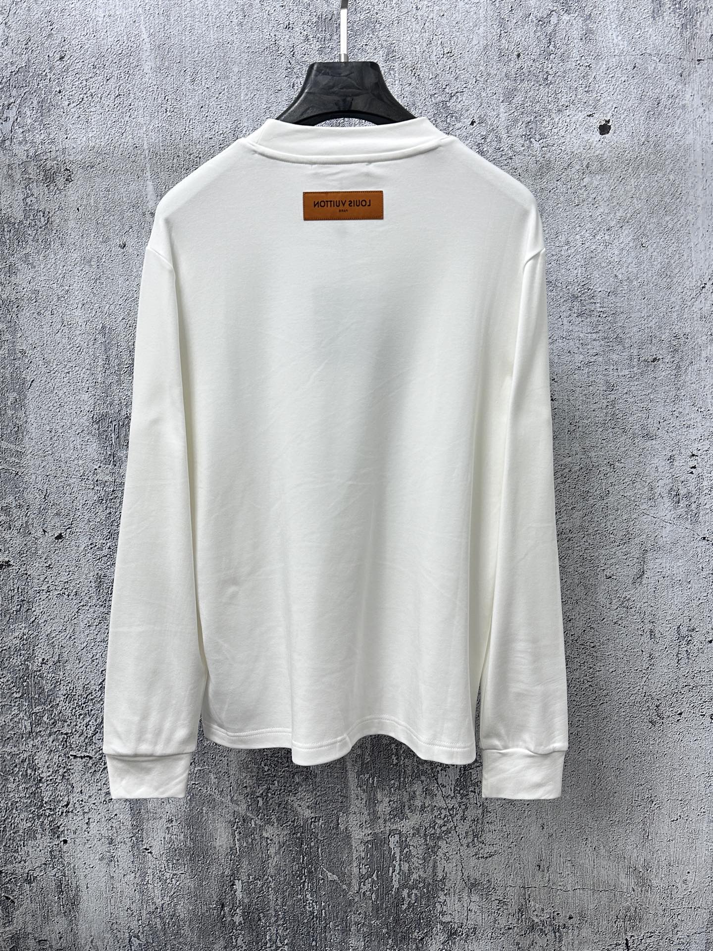 Louis Vuitton long-sleeve crewneck shirt in white, back view with neck label