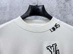 Louis Vuitton white long-sleeve crewneck shirt close-up of neckline and chest emblem