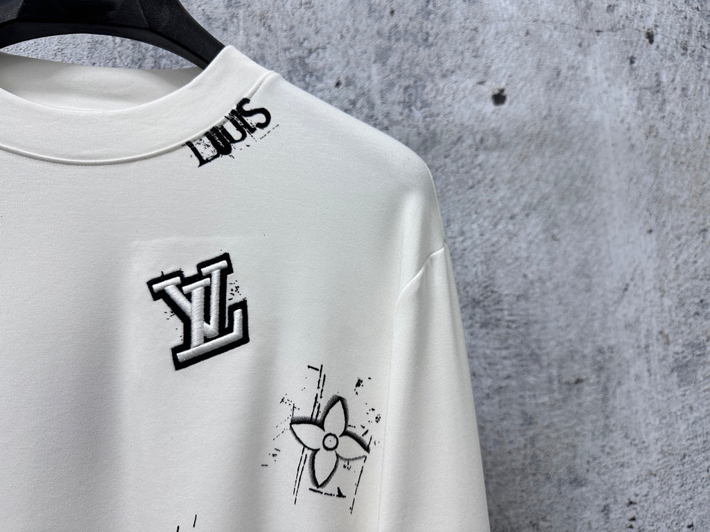 Louis Vuitton white long-sleeve crewneck shirt close-up of chest logo and graphic