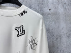 Louis Vuitton white long-sleeve crewneck shirt close-up of chest logo and graphic