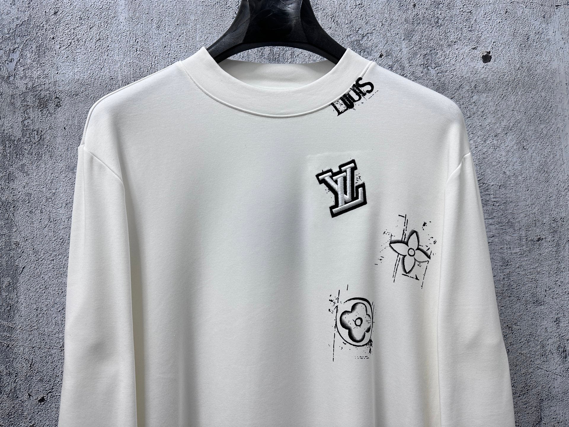 Louis Vuitton white long-sleeve crewneck shirt with front logo and character graphic