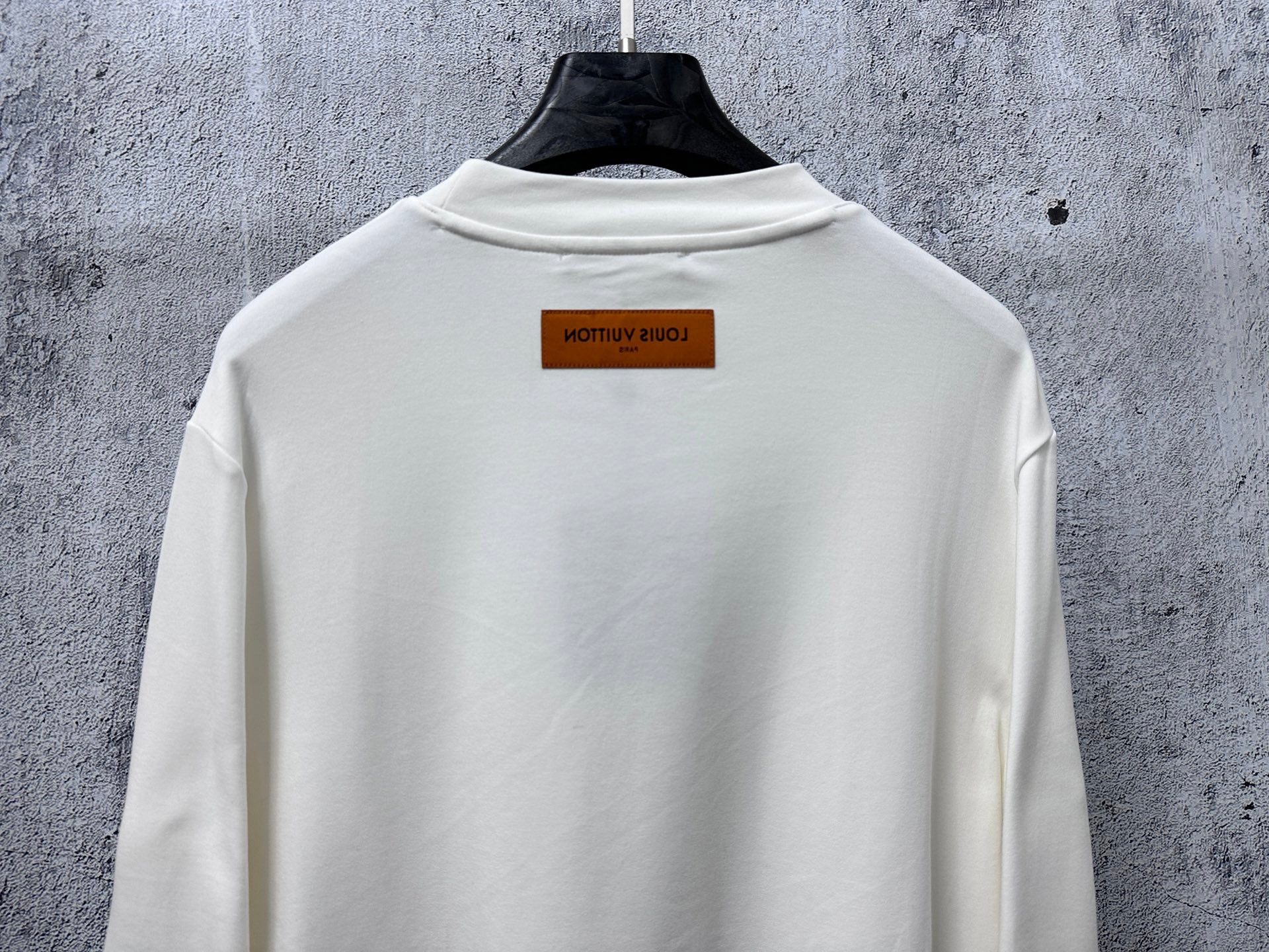 Louis Vuitton white long-sleeve crewneck shirt close-up of back with neck label