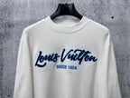 White Louis Vuitton long-sleeve T-shirt front view with blue logo and 'Since 1854'