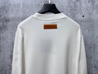 White Louis Vuitton long-sleeve T-shirt back view with rectangular neck tag