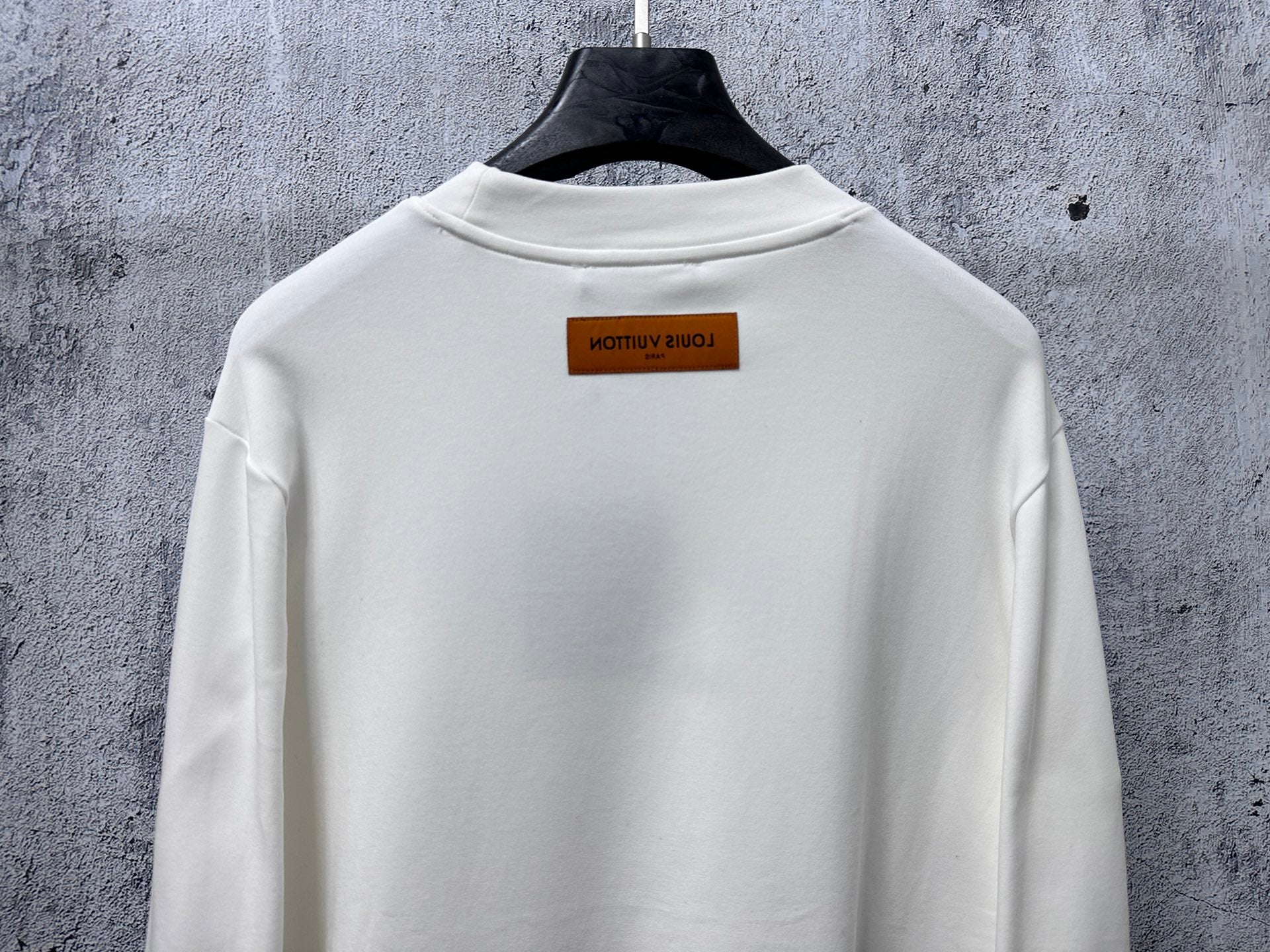 White Louis Vuitton long-sleeve T-shirt back view with rectangular neck tag