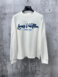 White Louis Vuitton long-sleeve T-shirt with blue logo and 'Since 1854' print