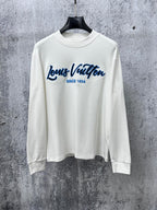 White Louis Vuitton long-sleeve T-shirt with blue logo and 'Since 1854' print