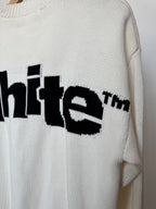Off-white knit sweater with black “white” logo graphic on sleeve