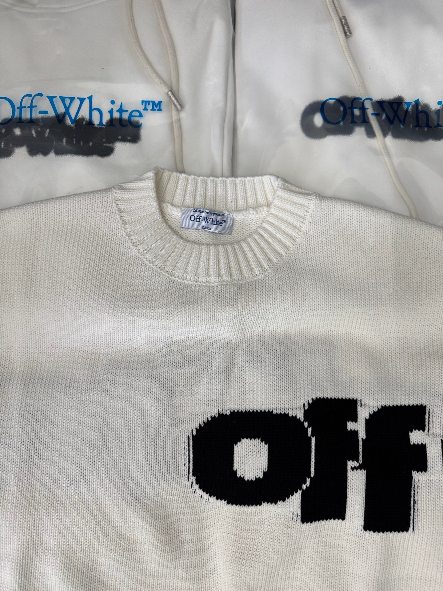 Off-White™ knit sweater detail, off-white with ribbed collar and partial black logo