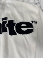 Off-White™ knit sweater back close-up, off-white with black "te" logo text