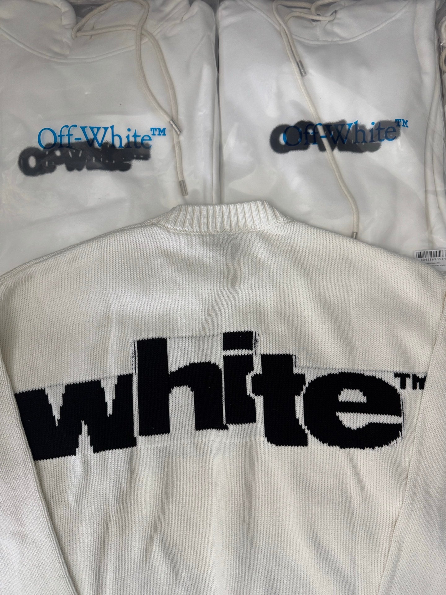 Off-White™ knit sweater back detail, off-white with oversized black "white" lettering