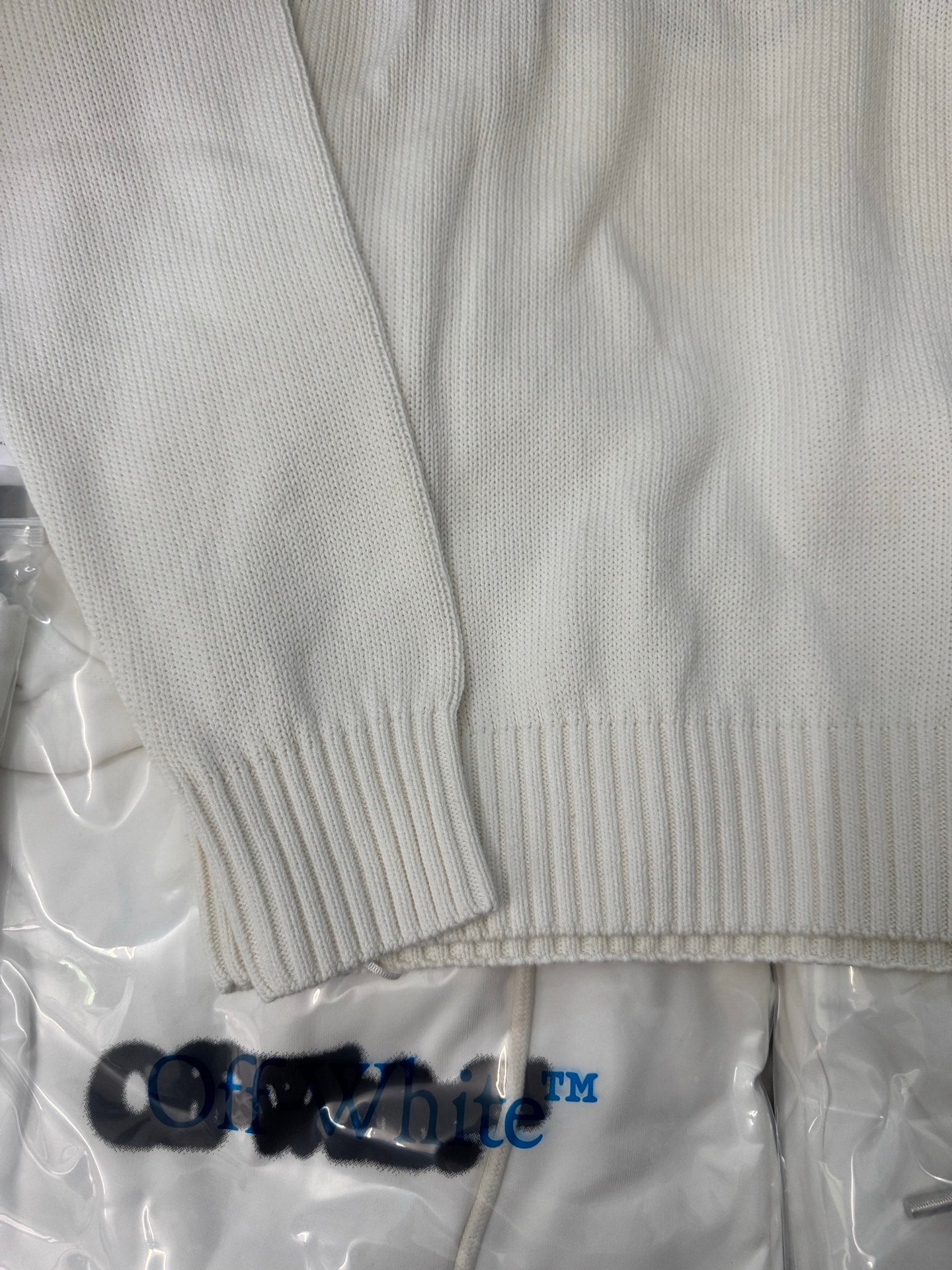Off-White™ knit sweater back hem and sleeve cuff, off-white ribbed trim