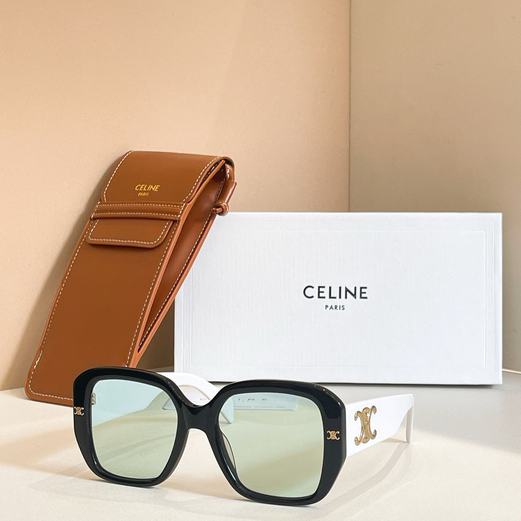 Black square sunglasses with light green-tinted lenses and ornate temple motif