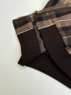 Plaid jacket panel with black lining and gold zip hardware