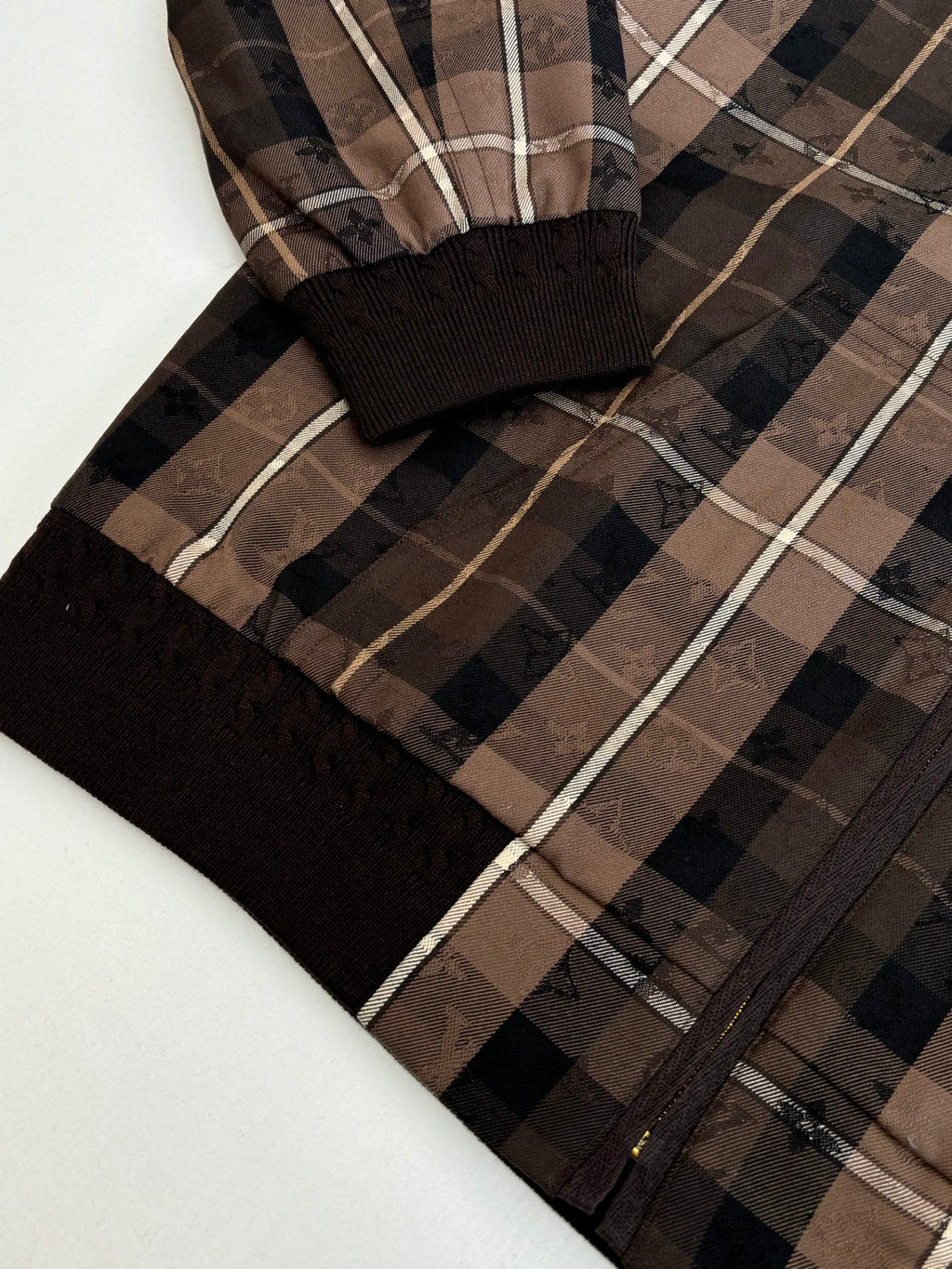 Plaid jacket sleeve with black ribbed cuff