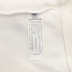 White sweatshirt interior size and care label near the neckline