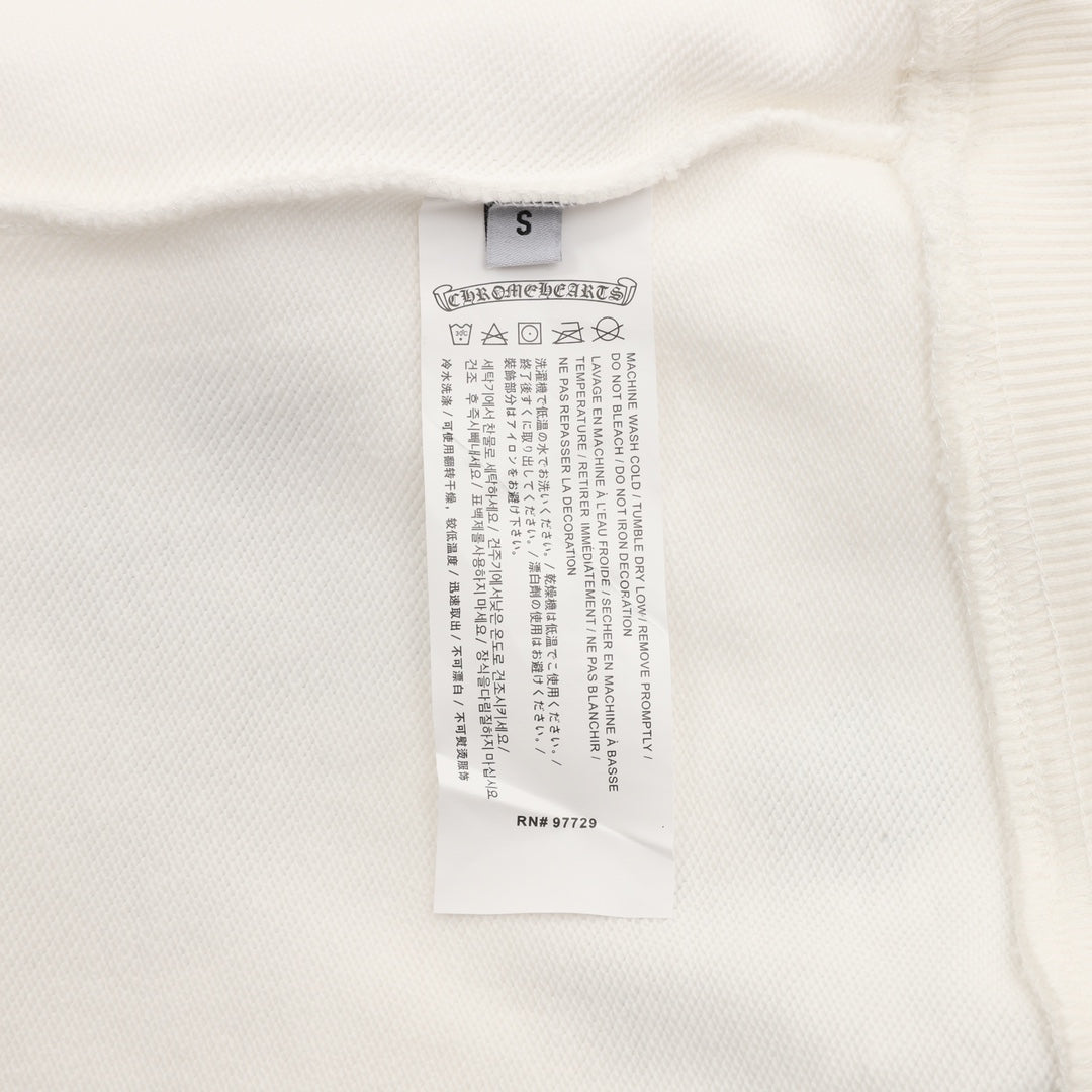 White sweatshirt interior size and care label near the neckline