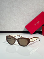 Prada glasses, brown frames with tan tinted lenses