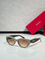 Prada glasses, beige frames with green-tinted lenses
